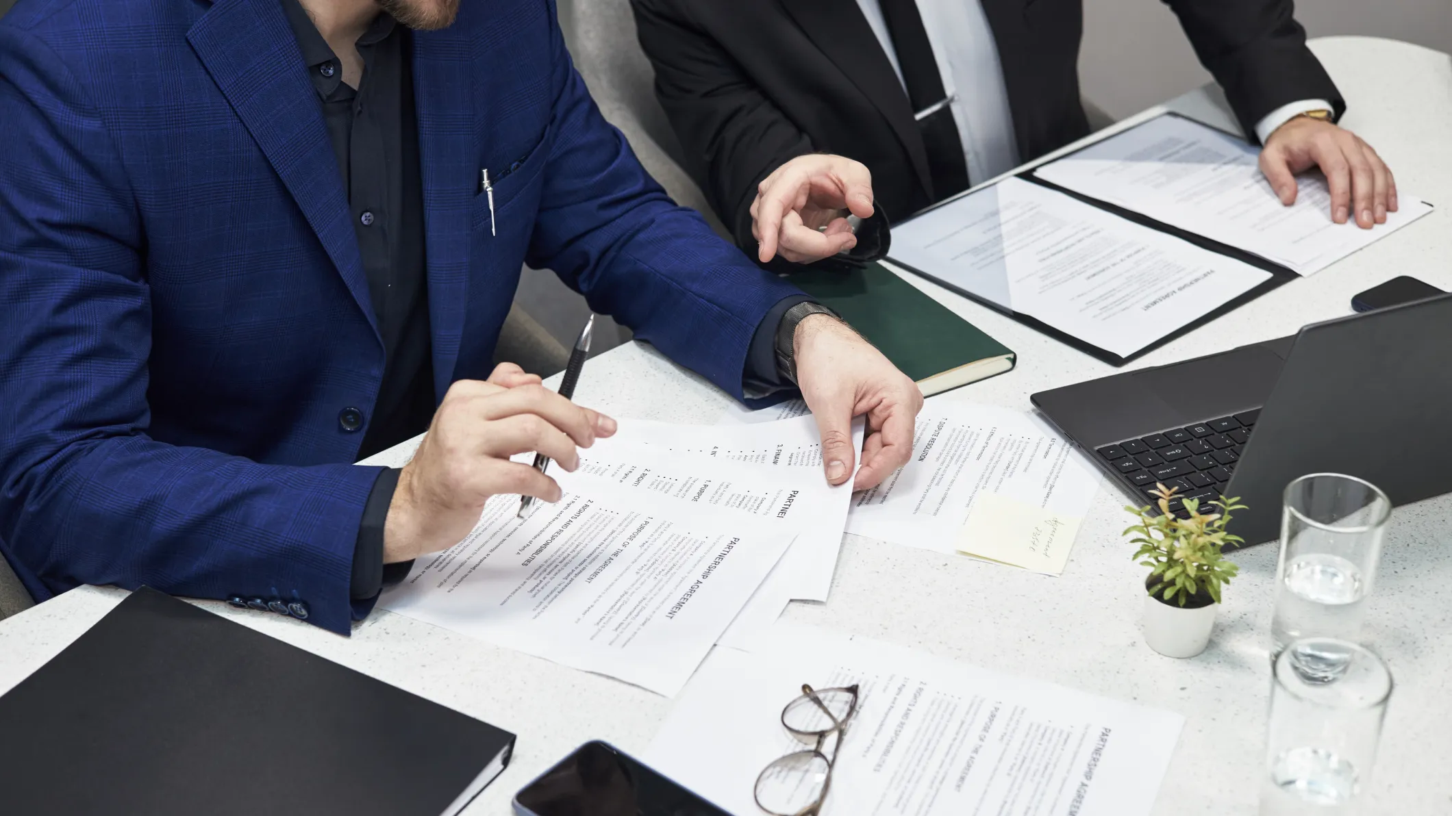 Procurement employees fulfilling the contract management process.