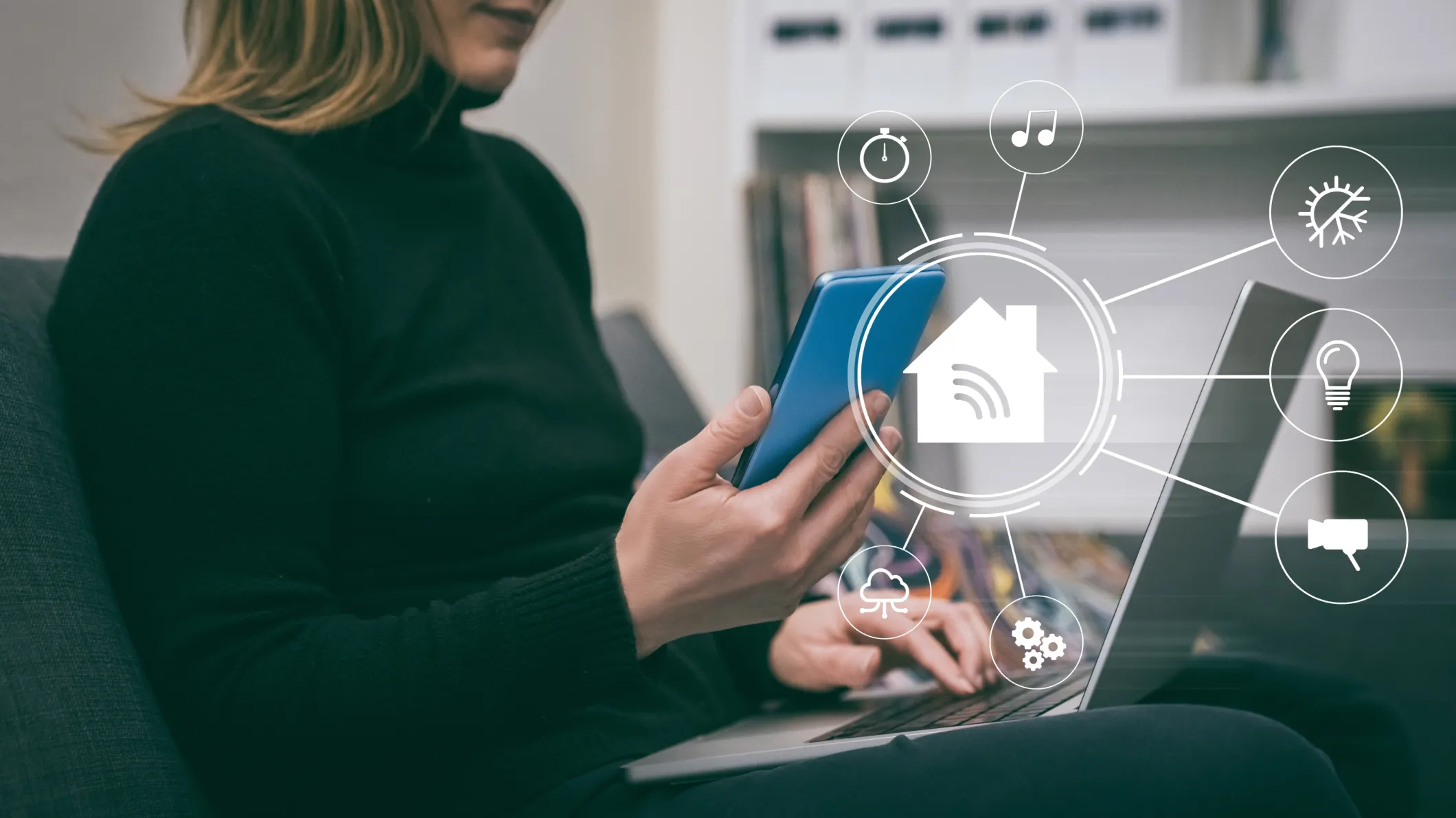Woman uses a smartphone and laptop