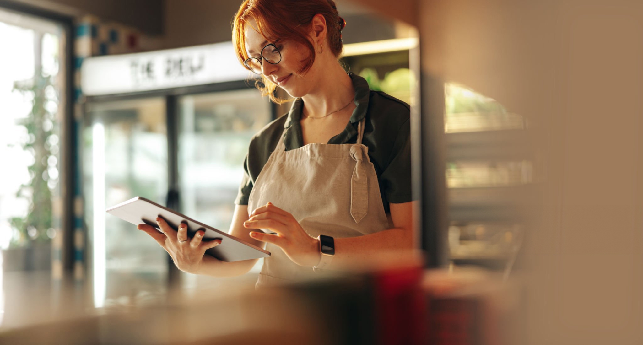 An image of a retail worker which was used within our 2025 Desk-Free Worker Report.